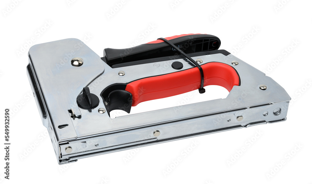 Manual metal stapler for staples and nails on a gray background Manual metal stapler for staples and nails on a gray background