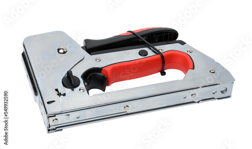 Manual metal stapler for staples and nails on a gray background