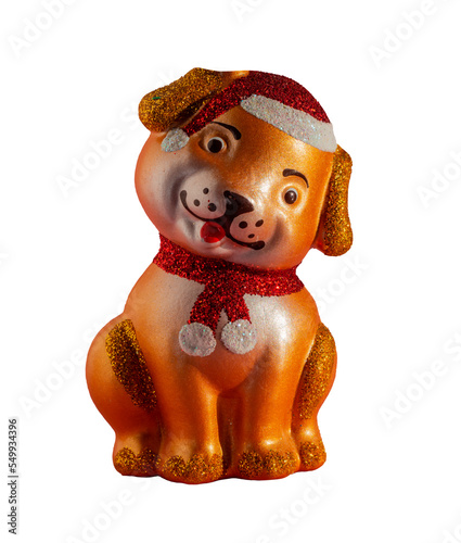 Decorative Christmas toy dog isolated on a transparent background. Toy dog in a Christmas hat and scarf © Alekskan12