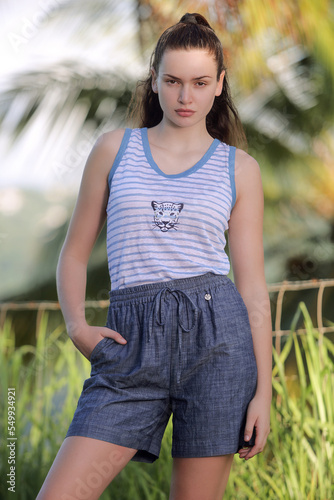 Young and pretty brunette wearing pret à porter in the french west indies.
