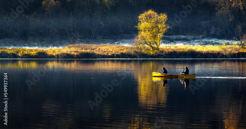 Tablou pe pânză Canoeing in a calm lake in the winter morning