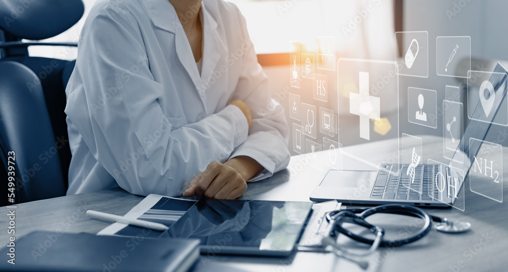 Medicine doctor using digital healthcare and network connection on hologram modern virtual screen interface icons, Medical technology futuristic concept. Medicine doctor using digital healthcare and network connection on hologram modern virtual screen interface icons, Medical technology futuristic concept.