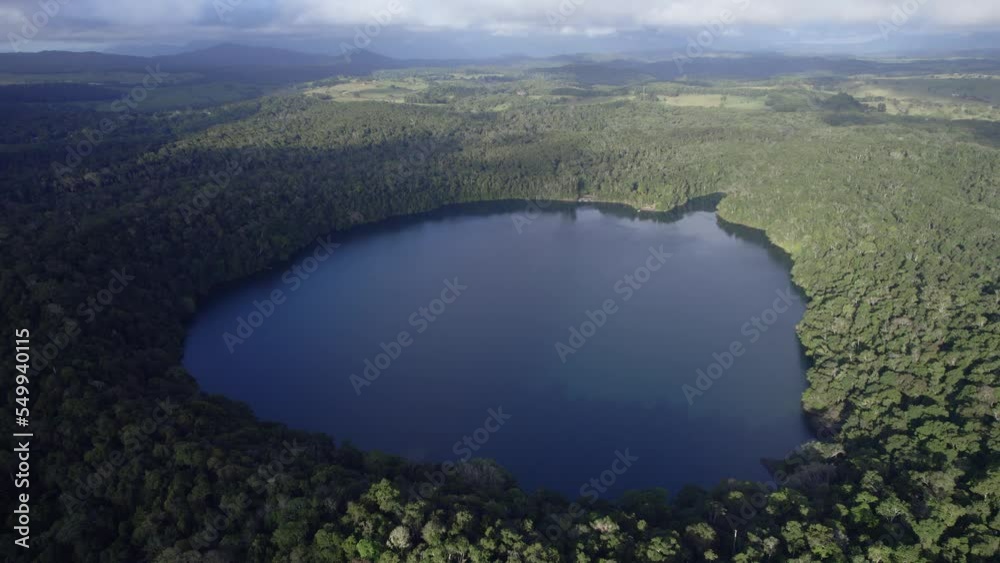 Lake Eacham - Lake Of Volcanic Origin On The Atherton Tableland Of Queensland, Australia - aerial drone shot Lake Eacham - Lake Of Volcanic Origin On The Atherton Tableland Of Queensland, Australia - aerial drone shot
