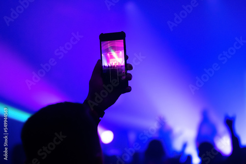 Video and photo recording of the Color music concert by smartphone. Beach party.