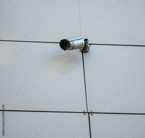 Surveillance camera on the wall of the building.