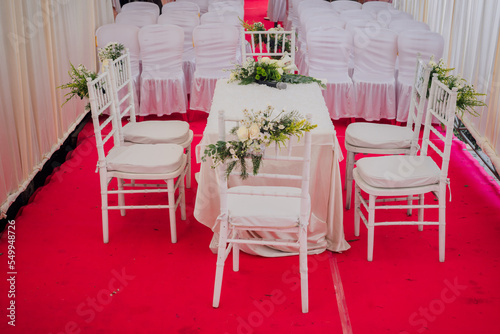 wedding ceremony table with fresh flower decoration and ready-to-use mic © ChoyMohd