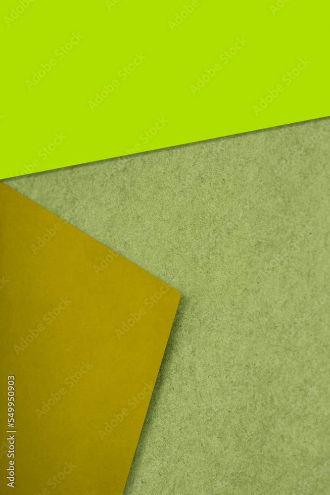 Plain and Textured papers randomly laying to form M like pattern and triangle for creative cover design idea Plain and Textured papers randomly laying to form M like pattern and triangle for creative cover design idea