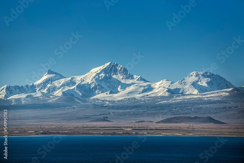 Beautiful shot of the Pekucuo lake and Shishapangma snowy mountains in Xigaze, China photo