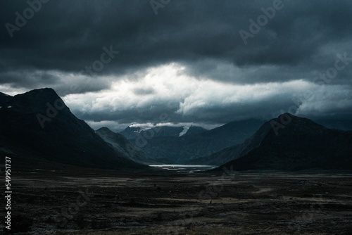 Mountains against a dramatic cloudy sky in Jotunheimen, Norway