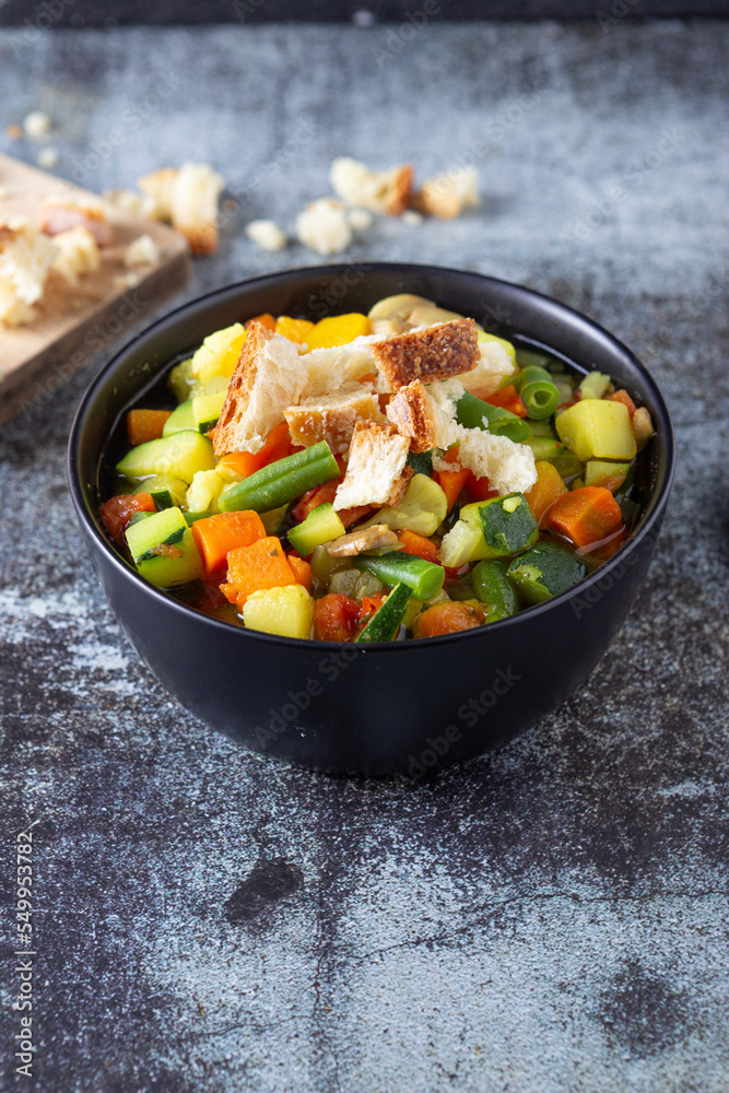 Minestrone with mixed vegetables with croutons. Healthy and nutritious dish, ideal for lunch or dinner and completely plant based. Vegetables soup. Minestrone with mixed vegetables with croutons. Healthy and nutritious dish, ideal for lunch or dinner and completely plant based. Vegetables soup.