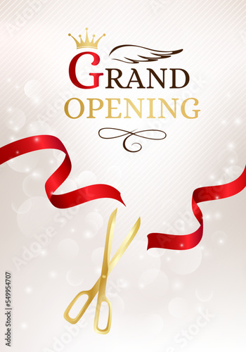 Grand opening banner with cut red ribbon and gold scissors.