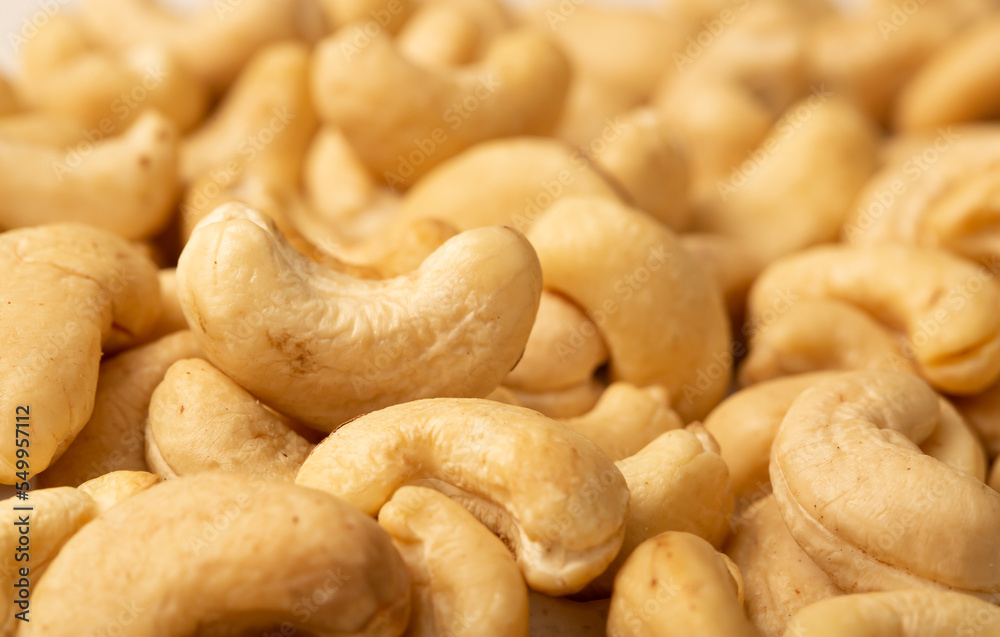 Cashew nuts as a background, top view. Cashew isolated on white background. Healthy foods. Cashew nuts as a background, top view. Cashew isolated on white background. Healthy foods.