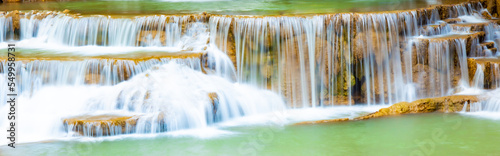 Amazing colorful waterfall in national park forest during spring beautiful deep forest in Thailand technic long exposure  during vacation and relax time.