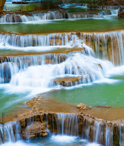 Fototapeta Naklejka Na Ścianę i Meble -  Amazing colorful waterfall in national park forest during spring,beautiful deep forest in Thailand,technic long exposure, during vacation and relax time.