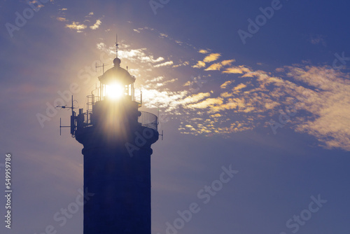 Sun shining through the lighthouse in Savudrija, Croatia. Safety, marine traffic, travel, tourism and hope concepts