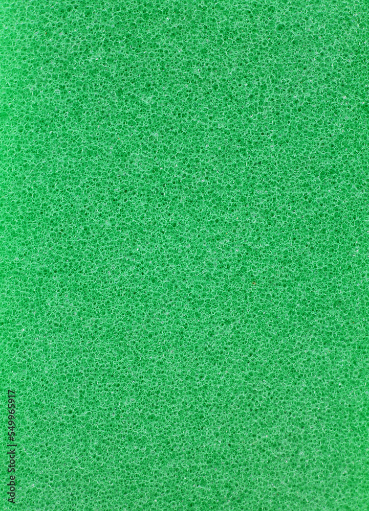 Fototapeta premium close-up green dishwashing sponge background