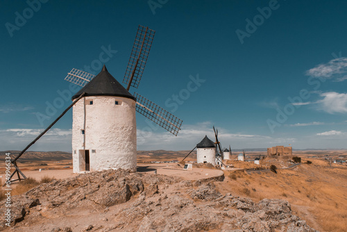 View of medieval Castle of Consuegra and Don Quixote windmills in Toledo, Spain