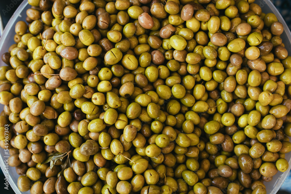 Green olives close up background.