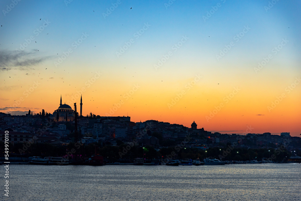 silhouette of the mosque and the city of Istanbul at sunset background