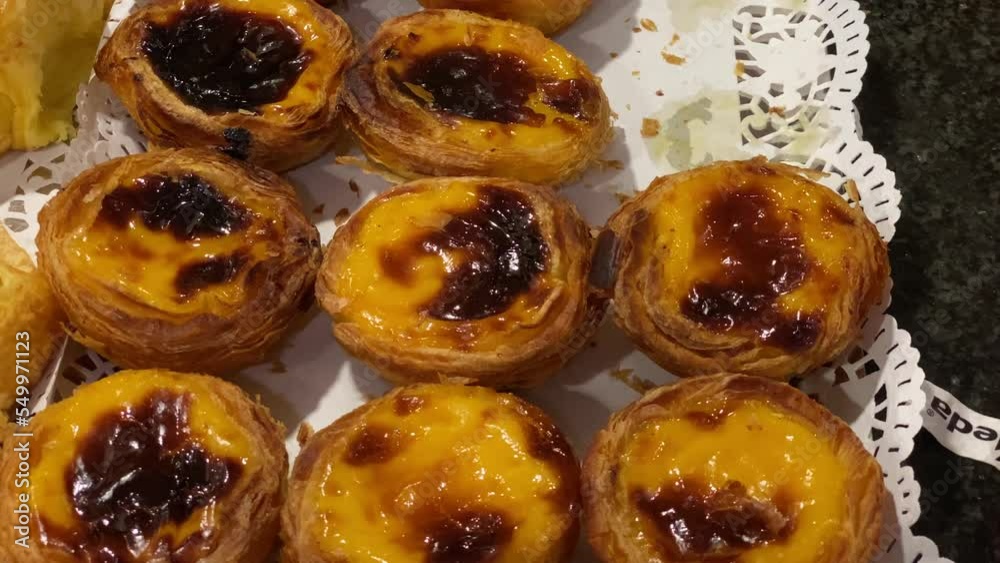 Pasteis de Nata Custard dessert tarts close up. Traditional Portuguese custard tarts Pasteis de Nata. Pasteis de Nata Custard dessert tarts close up. Traditional Portuguese custard tarts Pasteis de Nata.
