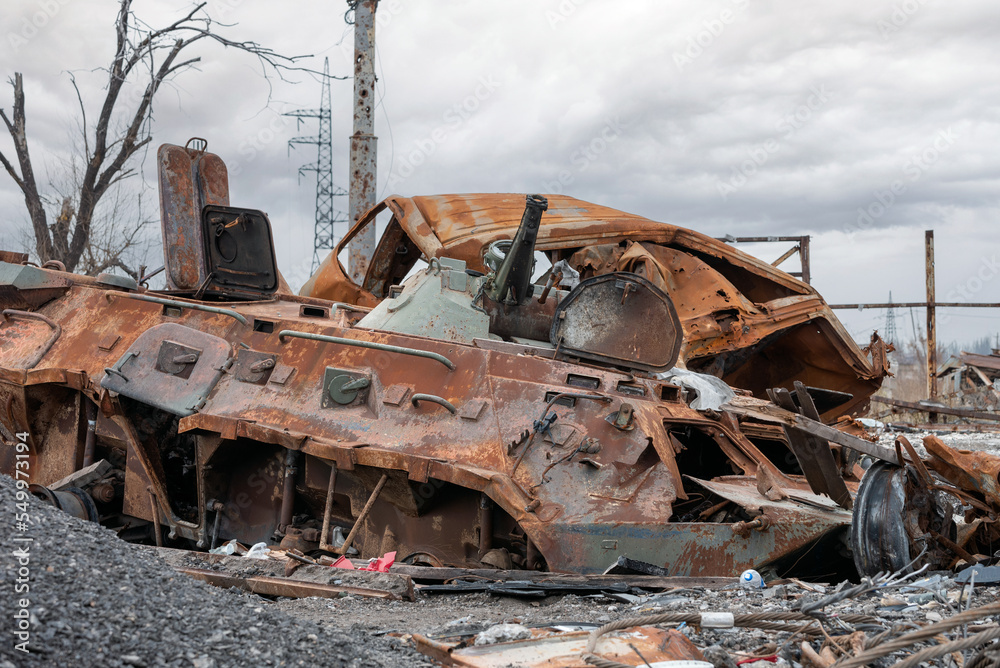 Fototapeta premium burnt tank and destroyed buildings of the Azovstal plant shop in Mariupol
