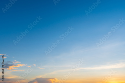 Fototapeta Naklejka Na Ścianę i Meble -  Twilight blue bright and orange yellow dramatic sunset sky in countryside or beach colorful cloudscape texture with white clouds air background.