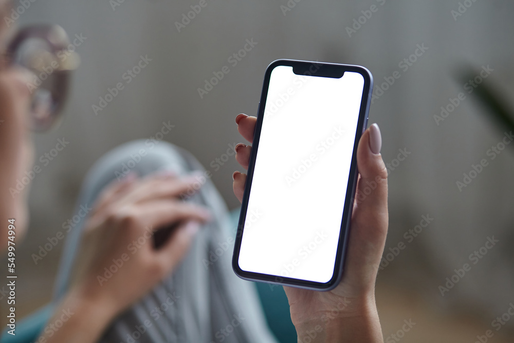 Mock up white screen blank close up mobile phone in woman hands holding ...