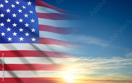 USA flag on background of sunset or sunrise. Greeting card for Veterans Day or Memorial Day