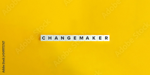Changemaker Word and Banner. Letter Tiles on Yellow Background. Minimal Aesthetics. photo