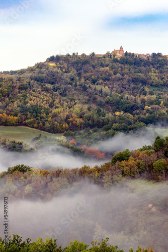 Morning mist under Mondaino  Emilia Romagna region  seen from Belvedere Fogliense between Pesaro and Urbino in the Marche region of Italy