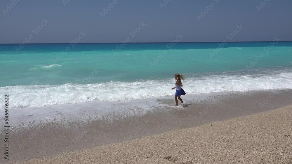 Kid Playing on Beach, Child Running on Seashore at Sunset, Little Girl Watching Sea Waves on Coastline Shore in Summer Vacation Kid Playing on Beach, Child Running on Seashore at Sunset, Little Girl Watching Sea Waves on Coastline Shore in Summer Vacation