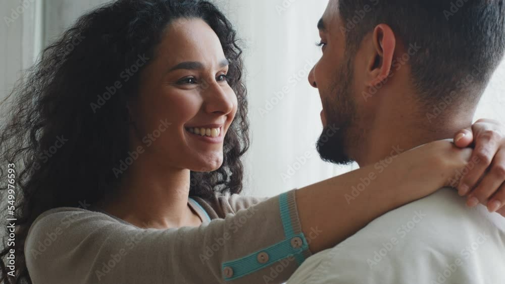 Multiracial multiethnic Hispanic Latino Indian couple in love married man and woman boyfriend and girlfriend husband and wife embracing at home romantic date hugging hug embrace cuddle cuddling bond Multiracial multiethnic Hispanic Latino Indian couple in love married man and woman boyfriend and girlfriend husband and wife embracing at home romantic date hugging hug embrace cuddle cuddling bond