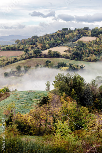 Morning mist and clouds over the Montefeltro hills near Belvedere Fogliense between Pesaro and Urbino in the Marche region of Italy