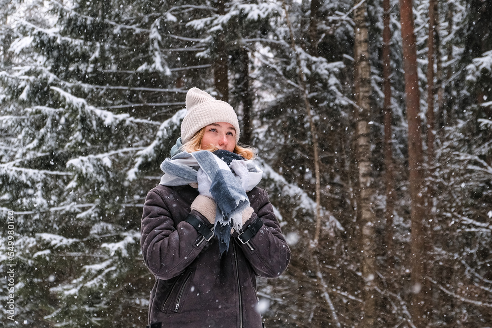 Winter.woman walks through winter snowy forest. Mental and physical health. Unity with nature.travel outdoors, hiking, spending time outdoors,winter travel,slow life,christmas forest.