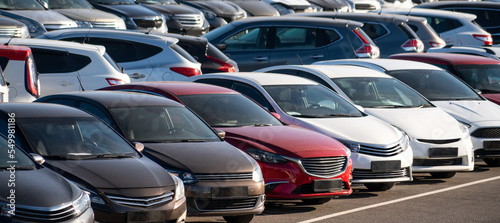 A lot of cars in a rows. Used car sales