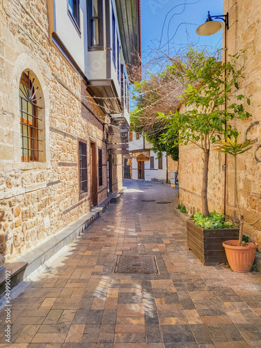 Fototapeta Naklejka Na Ścianę i Meble -  Old narrow cozy street in the old city of Kaleiçi in Antalya