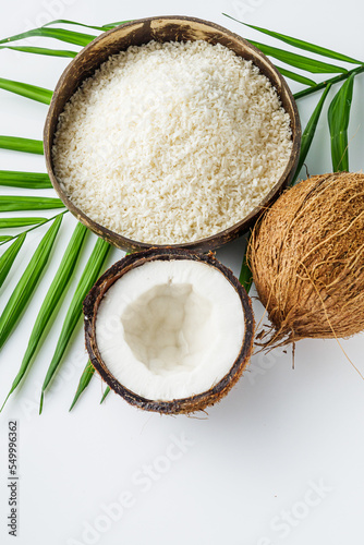 fresh natural coconut and shavings dried flakes on white acrylic background
