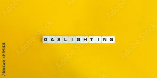 Gaslighting Word and Banner. Letter Tiles on Yellow Background. Minimal Aesthetics.
