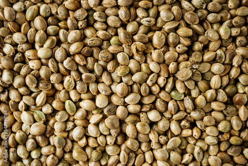 natural hemp seed on black stone background