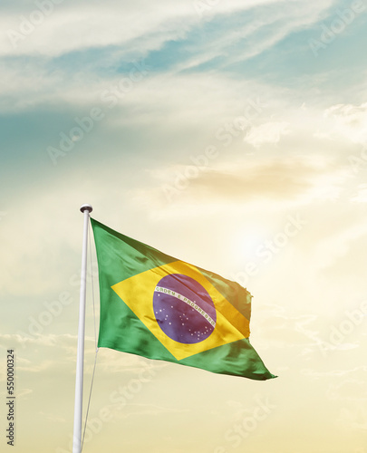 Photo Waving Flag of Brazil with beautiful Sky.