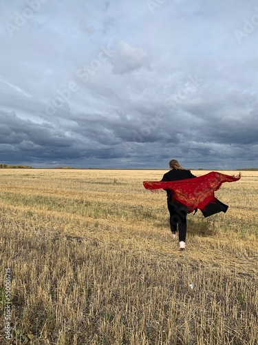 person in a field of wheat