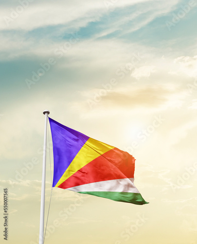 Waving Flag of Seychelles with beautiful Sky.