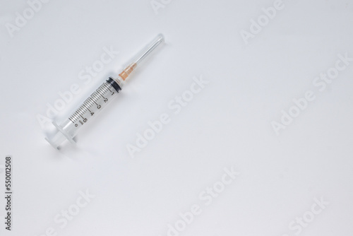 Syringe 5 ml with needle on white background, top veiw.