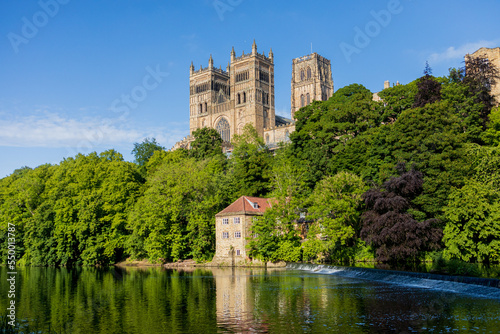 Durham England  2022-06-07  Durham Cathedral exterior during sunny summer day. View from river wear with lush green trees