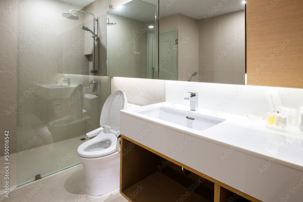 Loft white tile bathroom corner, tub and sink Loft white tile bathroom corner, tub and sink