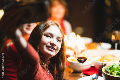 happy family with party taking selfie by smartphone at home christmas dinner