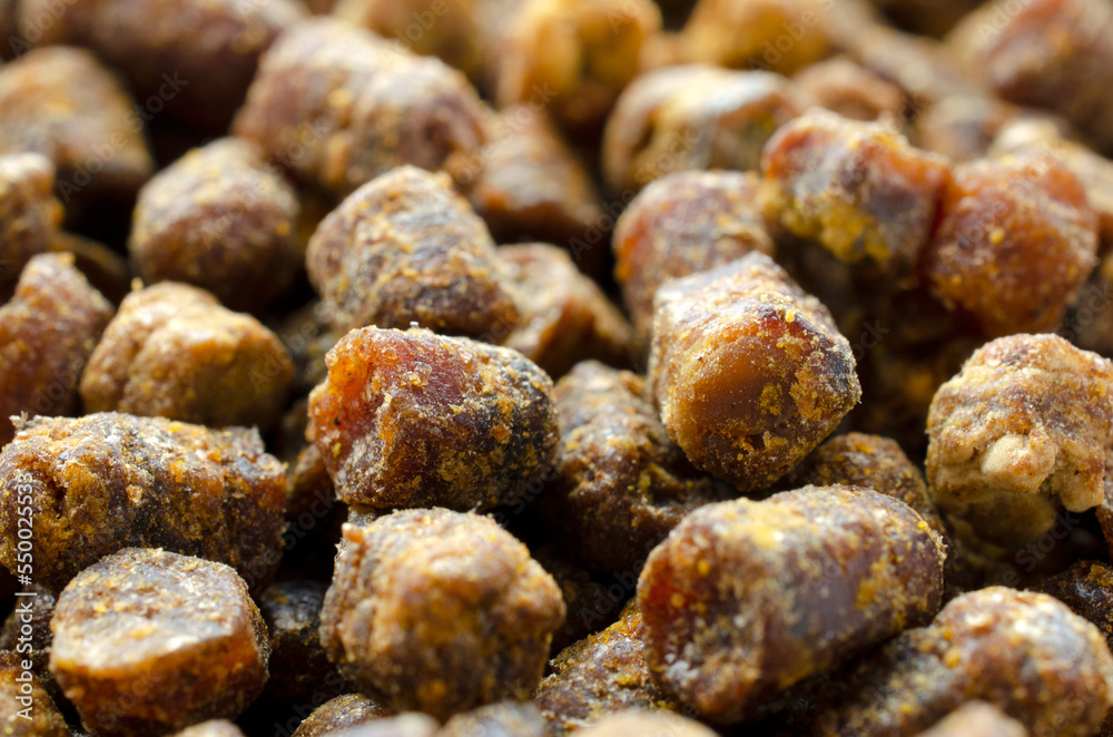 Top view of bee pollen. Bee perga, background, texture. Perga top view. Sperfood bee perga, background, texture, top view. Top view of bee pollen. Bee perga, background, texture. Perga top view. Sperfood bee perga, background, texture, top view.