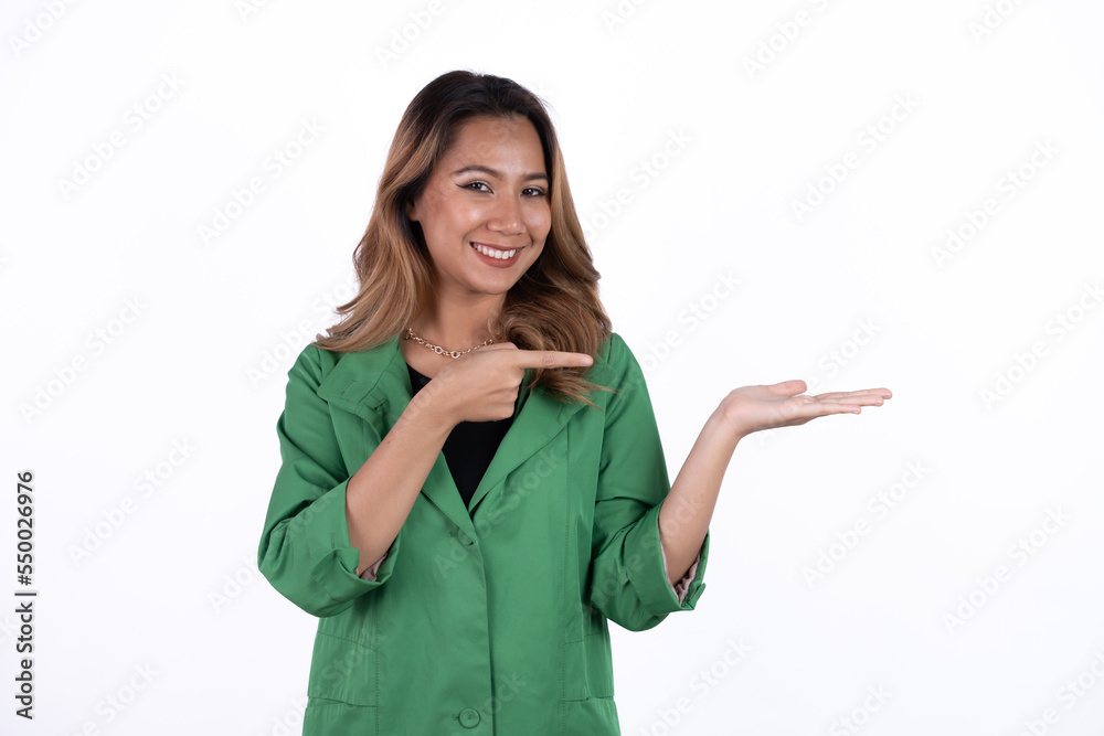 Smiling beautiful Asian woman pointing finger upward to empty space in studio white isolated background. Smiling beautiful Asian woman pointing finger upward to empty space in studio white isolated background.