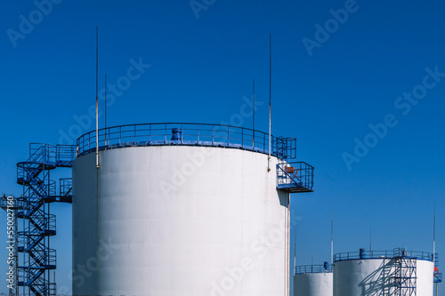 Vertical steel tank for storing petroleum products and flammable liquids. A park for storing petroleum products. Lightning protection device on tanks. Gasoline production.