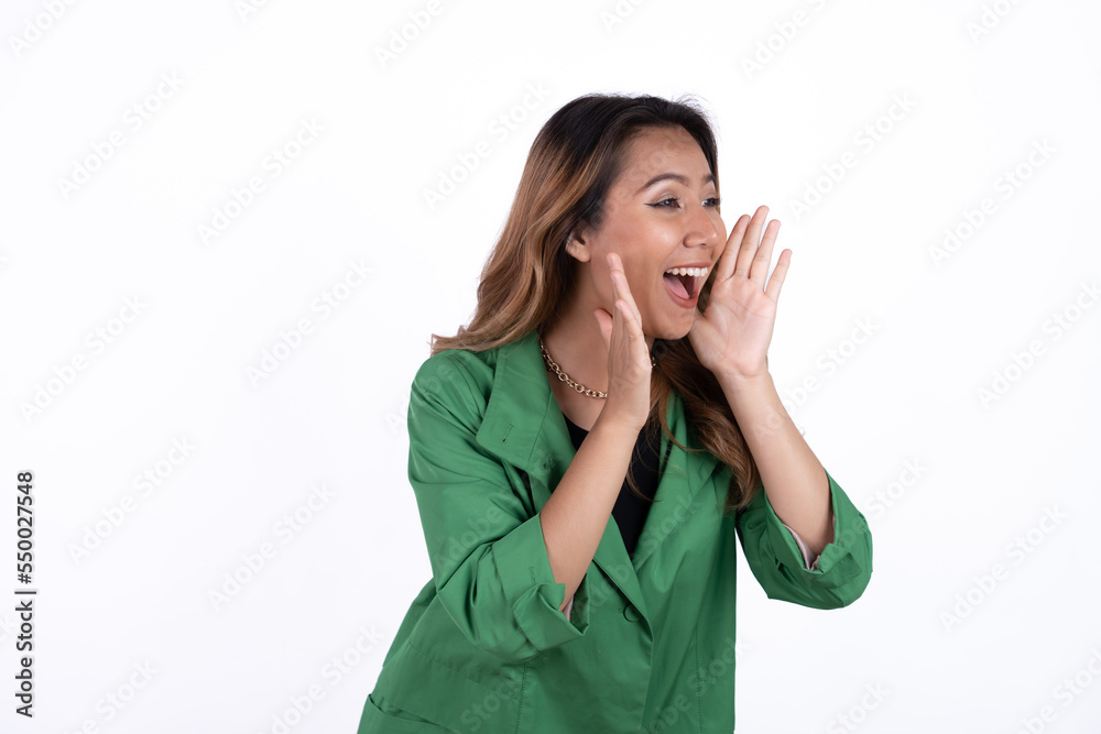 Asian woman with open mouths raising hands screaming announcement isolated on white background Asian woman with open mouths raising hands screaming announcement isolated on white background